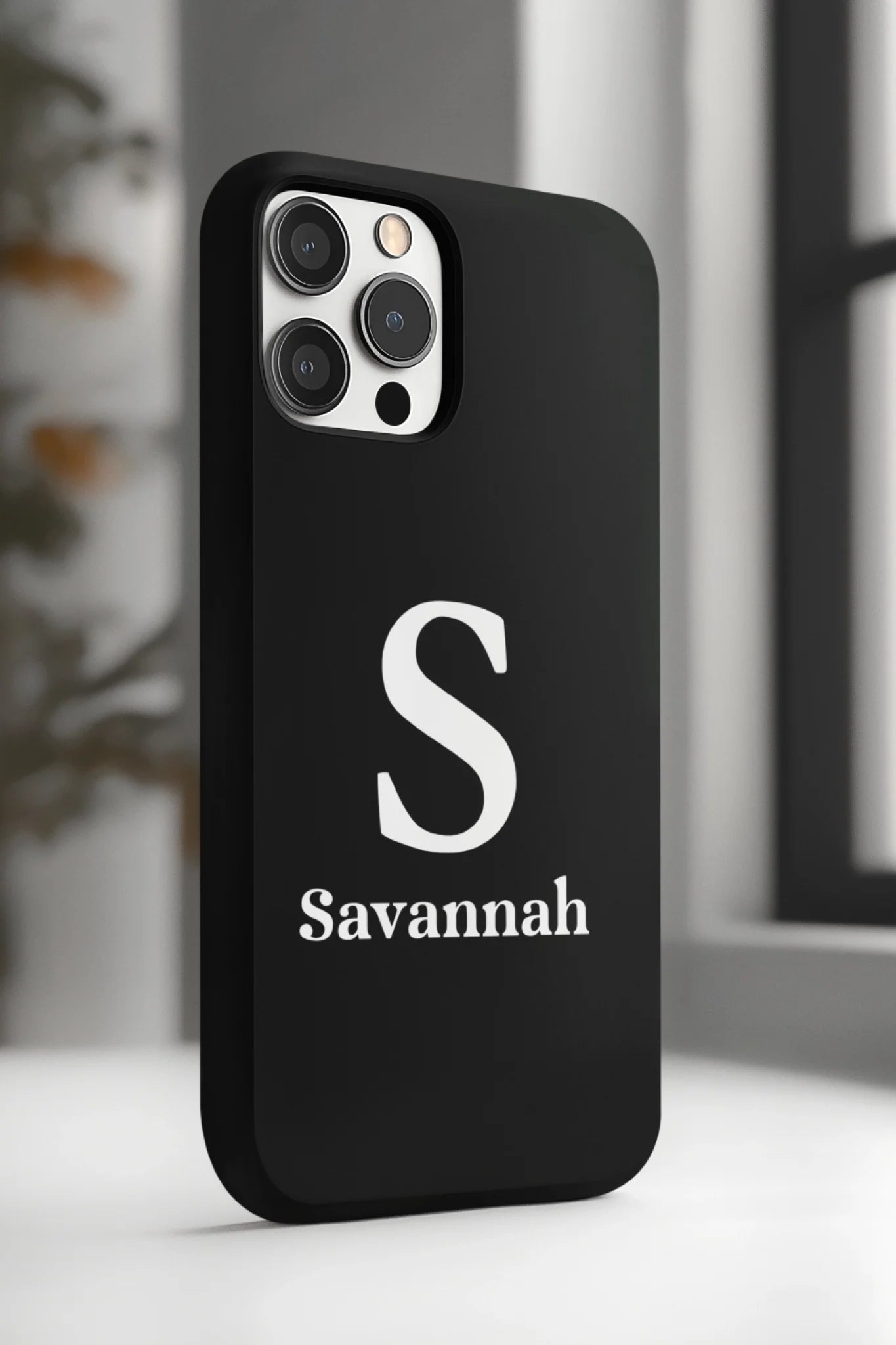 ai-created-phone-case-mockup-featuring-a-blurry-background-of-a-room-m51666